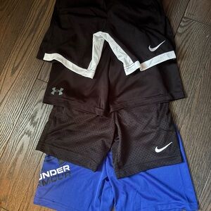 4 Pairs of Nike and Under Armour Kids Shorts